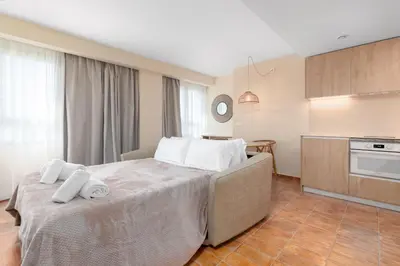 a bedroom with a bed with towels on it at Apartamentos Las Ciencias H in Valencia