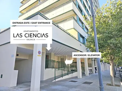 a building with two street signs in front of it at Apartamentos Las Ciencias L in Valencia