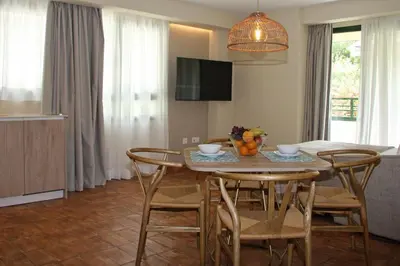 a kitchen and dining room with a table and chairs at Apartamentos Las Ciencias D in Valencia