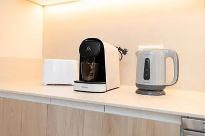 a coffee maker sitting on top of a counter at Apartamentos Las Ciencias Ñ in Valencia