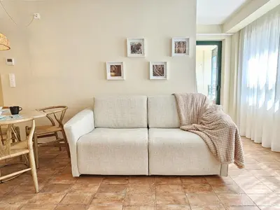 a living room with a couch and a table at Apartamentos Las Ciencias Ñ in Valencia