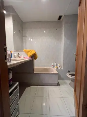 a bathroom with a tub and a sink and a toilet at Valencia Aparthotel COSMO in Valencia