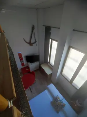an overhead view of a living room with a window at Loft duplex industrial near the sea + bicicles in Valencia