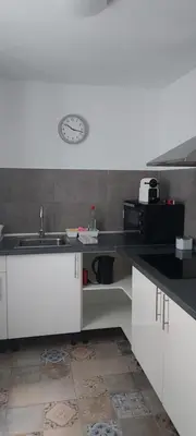 a kitchen with a sink and a microwave at dama iberica II in Valencia