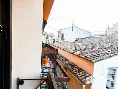 an apartment balcony with a view of roofs at Total Valencia El Carmen (Leisure & Culture) in Valencia