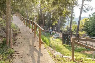 a walking path in a park with a playground at EL SECADERO in Alcudia de Veo