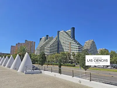 a sign in front of a city with tall buildings at Apartamentos Las Ciencias Studio Q in Valencia
