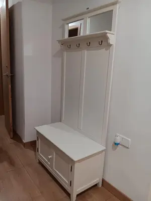 a white cabinet with a shelf in a room at Alojamiento Temporal para Familias, Turismo, Estudiantes y Trabajo 
