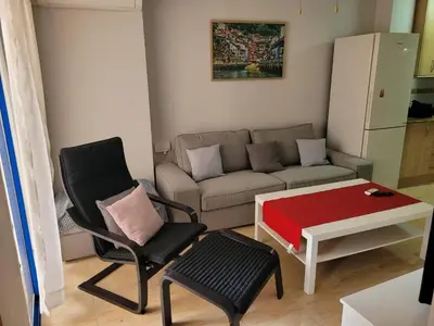 a small living room with a couch and a table at Apartamento en el Grau de Moncofa entre 2 y 3 linea de playa in Moncófar