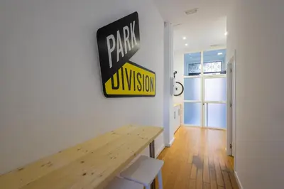 a room with a wooden table and a sign on the wall at FLORIT FLATS - The Vella Apartment in Valencia