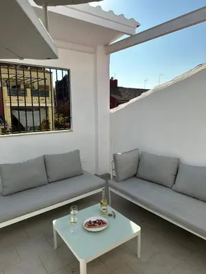 a living room with two couches and a table at Barraca Beach in Valencia