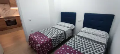 a room with two beds in a room at Precioso apartamento de diseño para 4-6 personas VT-55212-V in Valencia