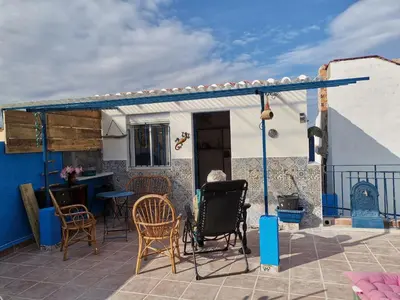 a person sitting on the patio of a house at Rony in Llaurí