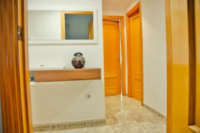 a bathroom with a sink and a mirror at Apartamento Playa Xilxes in Xilxes