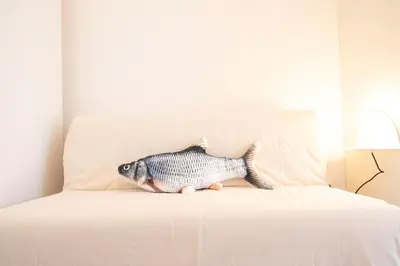 a fish toy sitting on top of a bed at Marino by Concept in Valencia