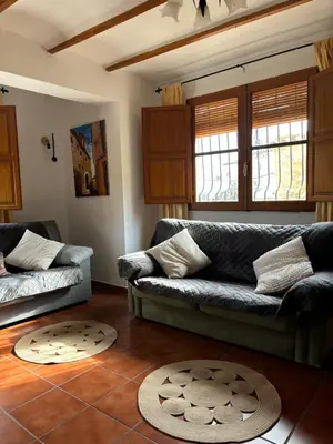 a living room with a couch and a table at RuralRusticHome in Altura