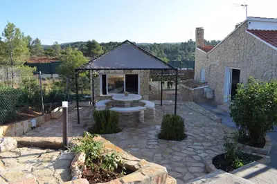 a garden with a gazebo and a fountain at Casa de campo Ismael in Siete Aguas