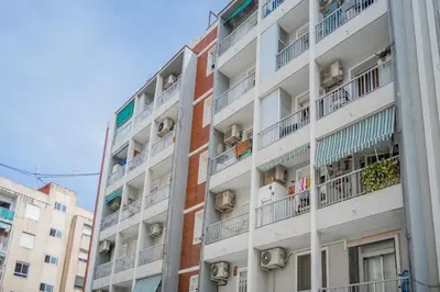an apartment building with balconies on a street at Alojamiento Náutico Junto a la Playa Malvarrosa in Valencia