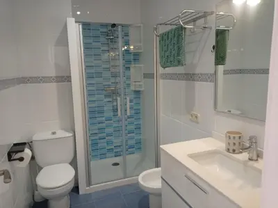 a bathroom with a shower and a toilet and a sink at Beach Nice Flat in Playa Pobla de Farnals