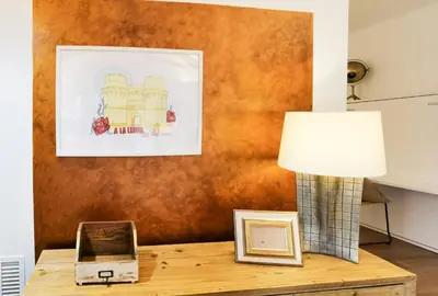 a table with a lamp and a picture on it at Torres de Serranos Apartments - TTdSSa VLC in Valencia