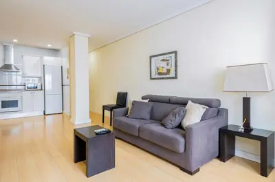 a living room with a couch and a table at Alcam Arte Ciencia in Valencia