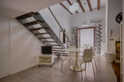 a kitchen with a sink and a clock on the wall at Apartamento REPESO in Valencia