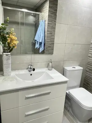 a bathroom with a white sink and a toilet at centrico cerca al ayuntamiento+luminoso+acogedor in Valencia