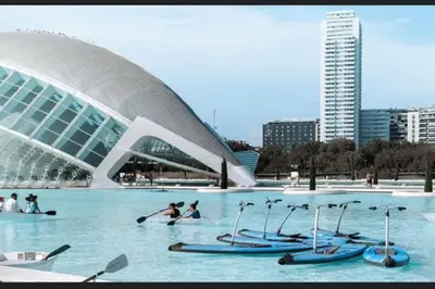 a group of people in the water in front of a building at centrico cerca al ayuntamiento+luminoso+acogedor in Valencia