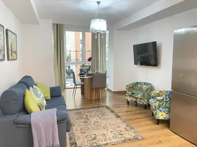 a living room with a blue couch and a tv at centrico cerca al ayuntamiento+luminoso+acogedor in Valencia