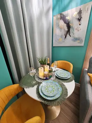 a table with two plates and candles on it at Lounge garden sea mint fresh in Valencia