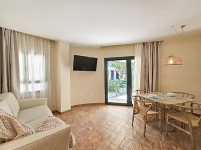 a living room with a couch and a table at Apartamentos Las Ciencias Studio Y in Valencia