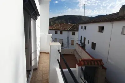 a view from the balcony of a white building at Casa rural para 8 huéspedes en plena naturaleza in Gestalgar