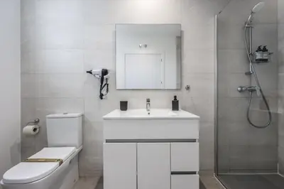 a bathroom with a toilet and a sink and a shower at AmazINN Valencia Cabanyal 3D in Valencia