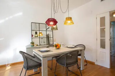 a dining room with a table and chairs at SingularStays Palacio de Congresos in Valencia