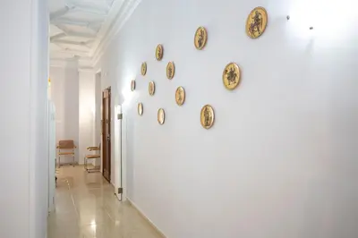 a hallway with many plates on the wall at SingularStays Salvador IV in Valencia
