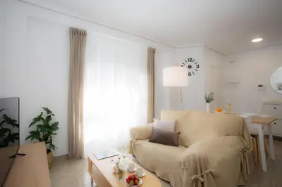 a living room with a couch and a table at SingularStays Campanar in Valencia