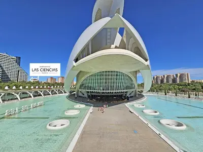 a large building with a pool in front of it at Apartamentos Las Ciencias Studio Z in Valencia