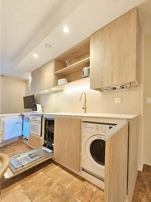 a kitchen with a washer and dryer at Apartamentos Las Ciencias U in Valencia