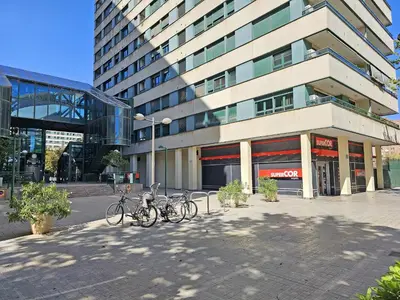 a group of bikes parked in front of a building at Apartamentos Las Ciencias U in Valencia