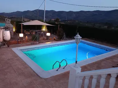 a swimming pool with two wedding rings in it at Alto Oasis in Siete Aguas