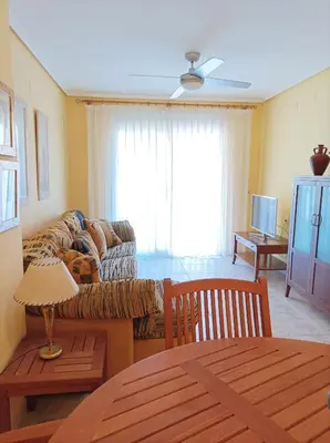 a living room with a couch and a table at Almar Collection Cullera Bahía Park in Cullera