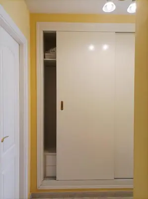 a closet with a white door in a room at Almar Collection Cullera Bahía Park in Cullera