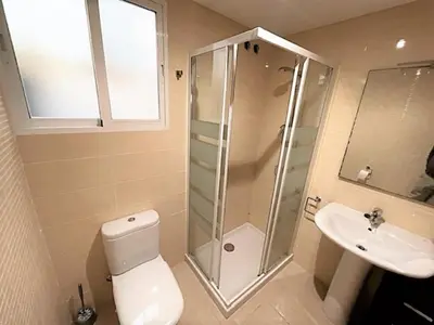 a bathroom with a shower and a toilet and a sink at Apartment Grao de Moncofar Ref 041 in Moncófar