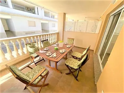 a dining room with a table and chairs at Apartment Grao de Moncofar Ref 041 in Moncófar