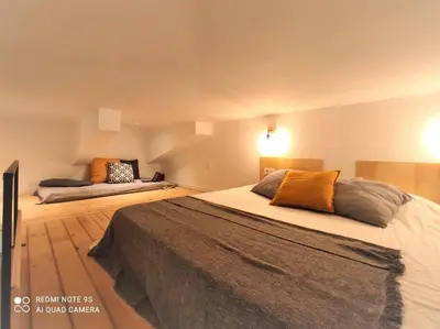 a bedroom with two beds in a room at lifecoliving valencia loft BR in Valencia
