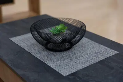 a black bowl with a plant in it on a table at Spacious OCEANOGRAFIC Flats Valencia in Valencia