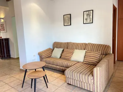 a living room with a couch and a table at Piso en Vall de Almonacid con vistas, aire acondicionado, Wifi y Smart TV in Vall de Almonacid