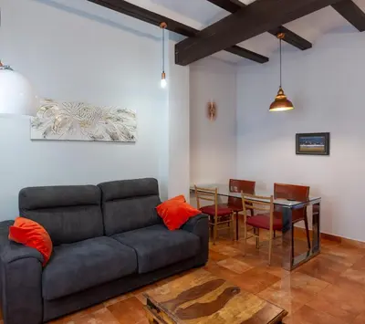 a living room with a couch and a table at Cozy apartment near the center, Torres de Serrano in Valencia
