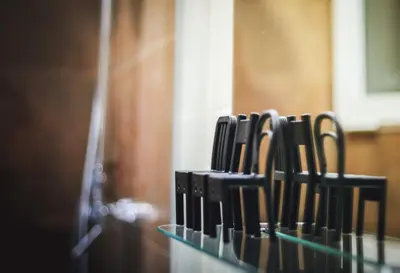 a row of knives lined up on a glass shelf at Cozy apartment near the center, Torres de Serrano in Valencia