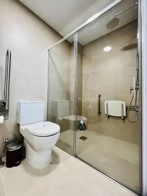 a bathroom with a toilet and a glass shower at Exclusive LOFT in Ruzafa (SOHO) in Valencia
